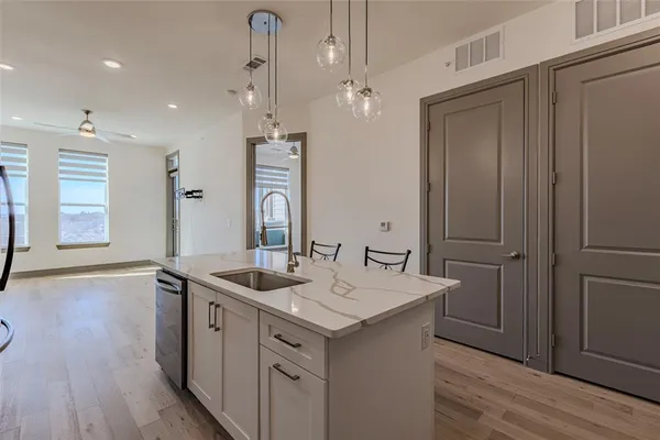 a bathroom with a sink a vanity and a mirror