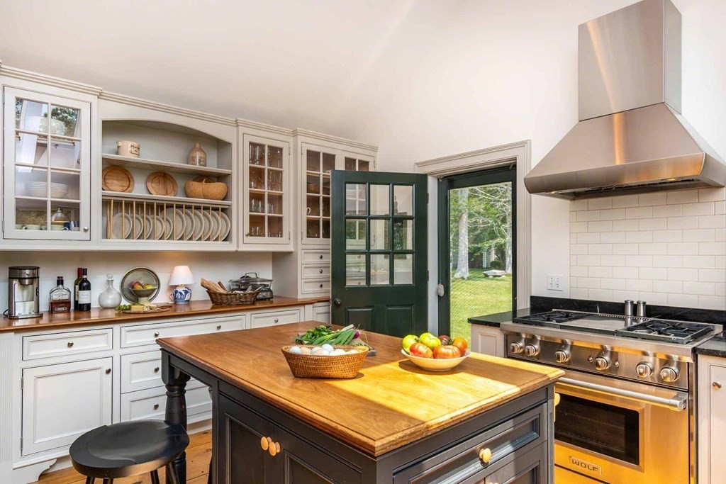 23 Indian Hollow Road West Tisbury, MA 02568 - Photo 17 of 42 a room with furniture and a stove