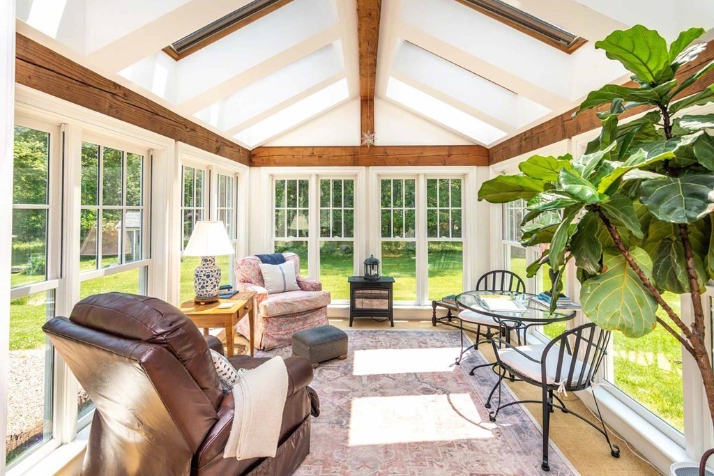 23 Indian Hollow Road West Tisbury, MA 02568 - Photo 18 of 42 a living room with furniture and a large window