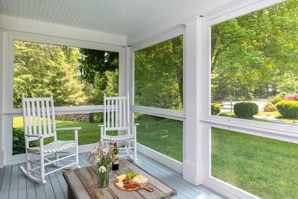 23 Indian Hollow Road West Tisbury, MA 02568 - Photo 22 of 42 a view of a city from a living room with a yard