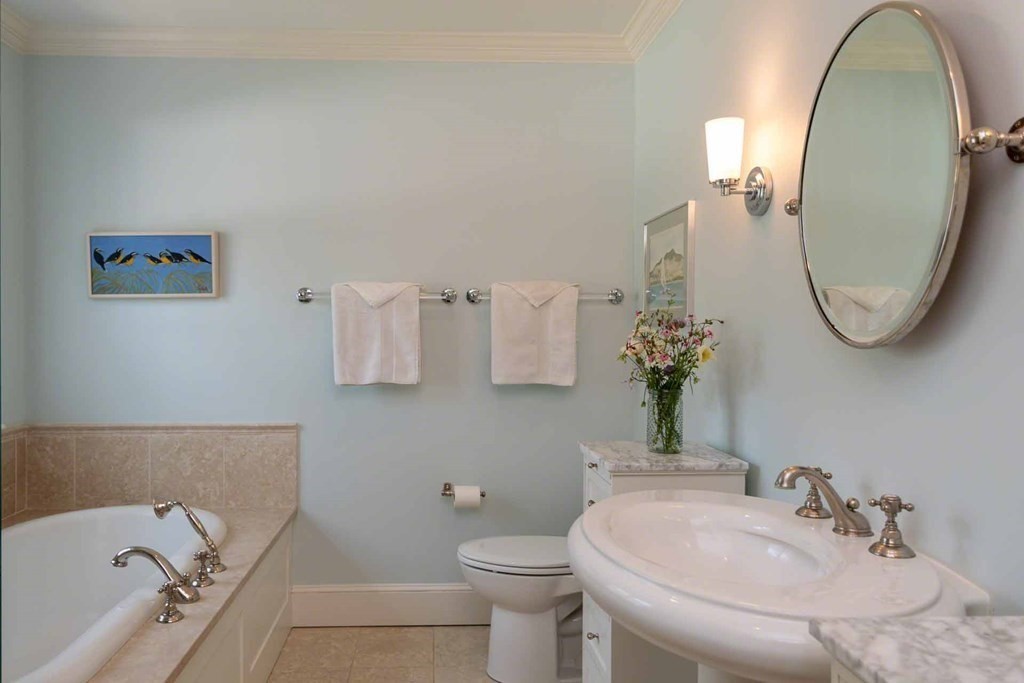 23 Indian Hollow Road West Tisbury, MA 02568 - Photo 26 of 42 a bathroom with a sink and a mirror