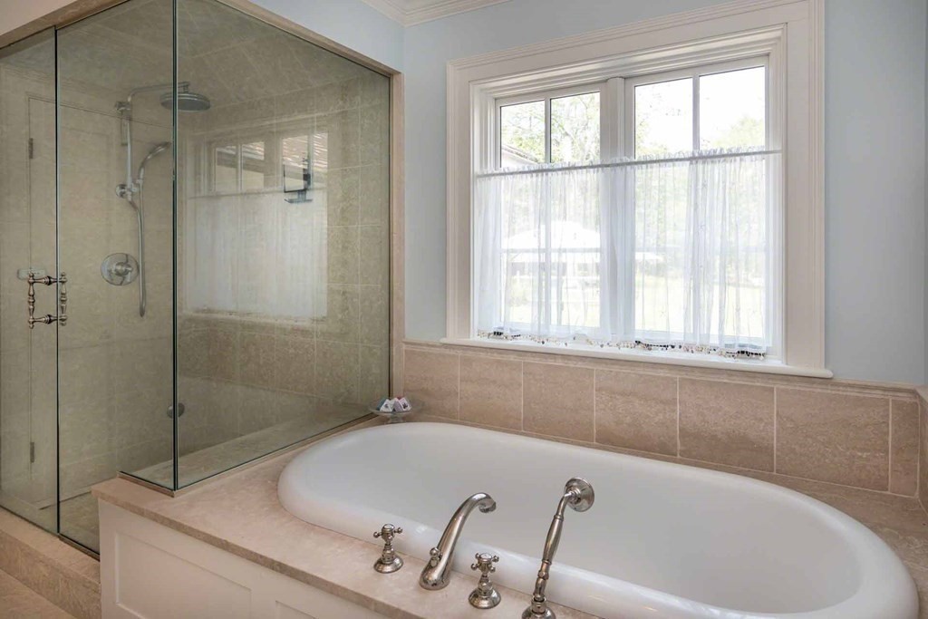 23 Indian Hollow Road West Tisbury, MA 02568 - Photo 27 of 42 a bath tub sitting next to a window
