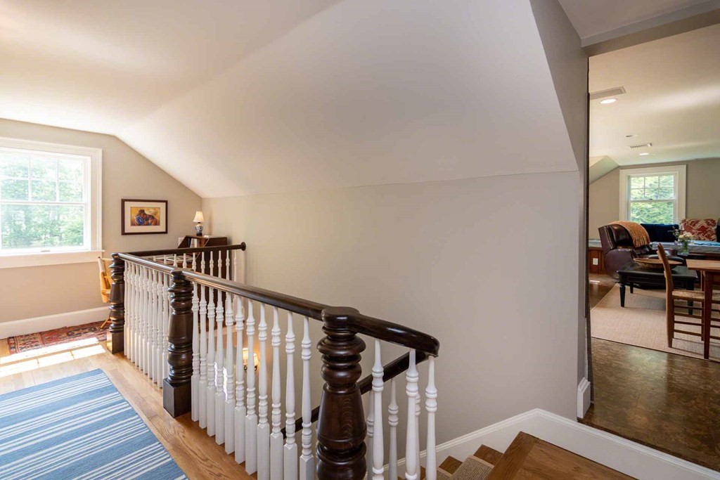 23 Indian Hollow Road West Tisbury, MA 02568 - Photo 28 of 42 a view of a hallway with wooden floor and staircase