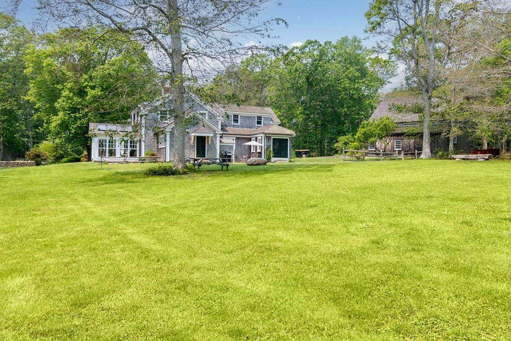 23 Indian Hollow Road West Tisbury, MA 02568 - Photo 40 of 42 a front view of house with yard and trees