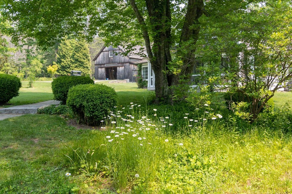 23 Indian Hollow Road West Tisbury, MA 02568 - Photo 41 of 42 a front view of a house with garden