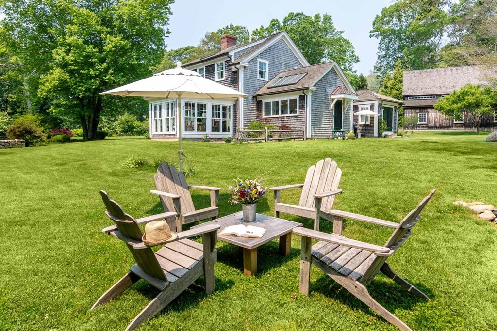 23 Indian Hollow Road West Tisbury, MA 02568 - Photo 6 of 42 a view of a house with backyard porch and sitting area