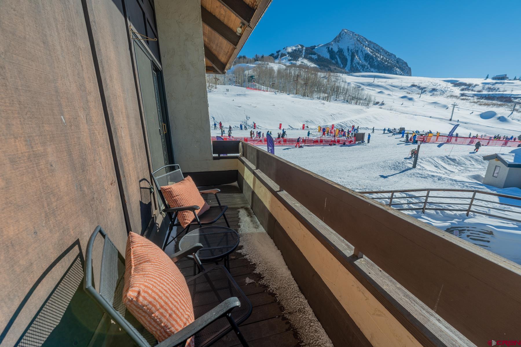 14 Snowmass Road, Unit 301 Crested Butte, CO 81225 - Photo 11 of 35 a view of a balcony with chairs
