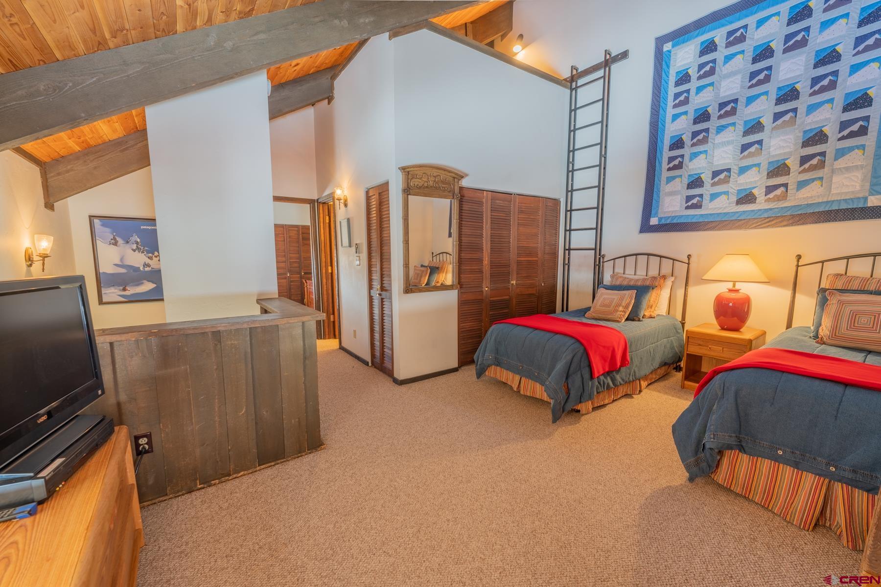 14 Snowmass Road, Unit 301 Crested Butte, CO 81225 - Photo 20 of 35 a bedroom with bed and furniture