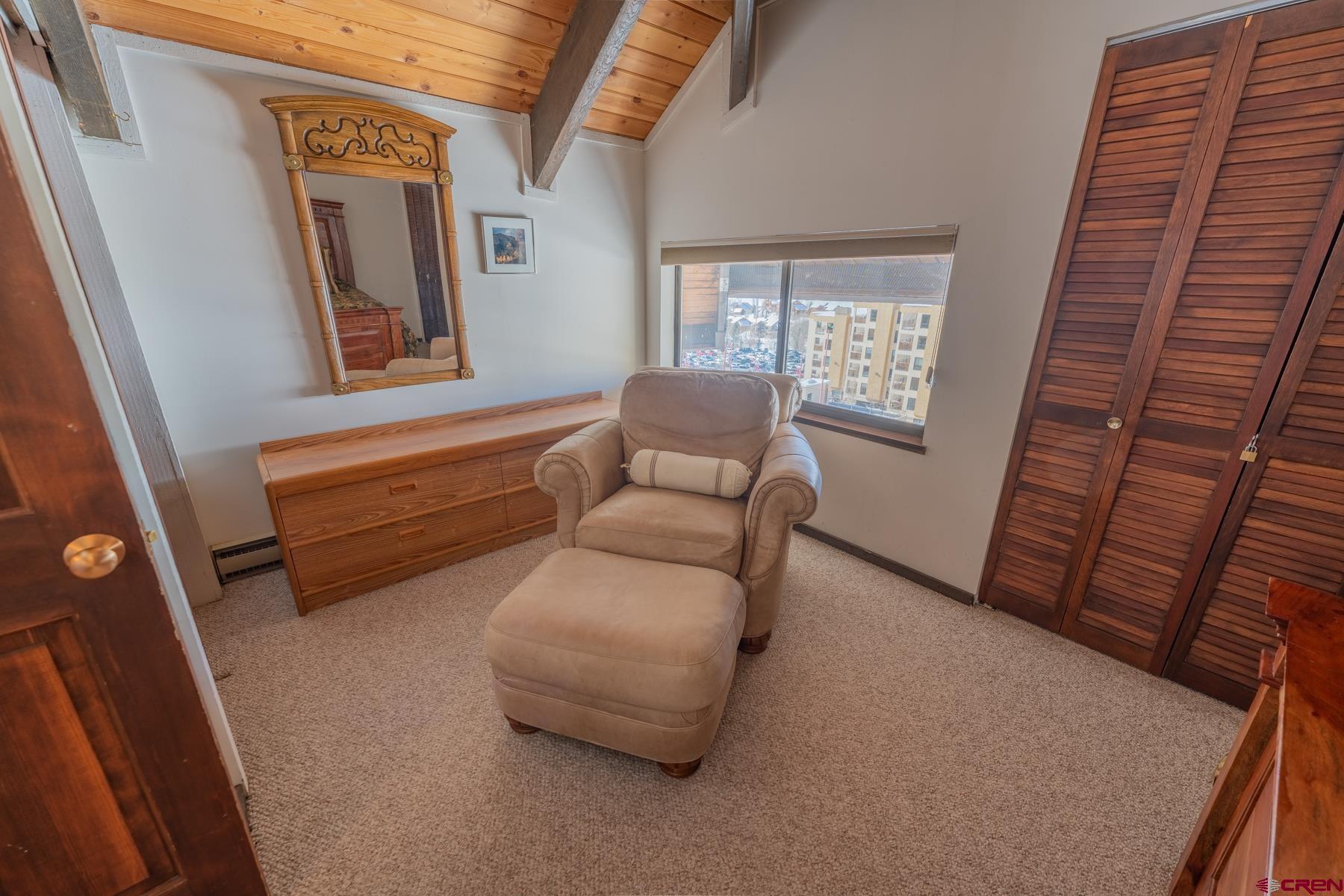 14 Snowmass Road, Unit 301 Crested Butte, CO 81225 - Photo 26 of 35 a living room with furniture and a window