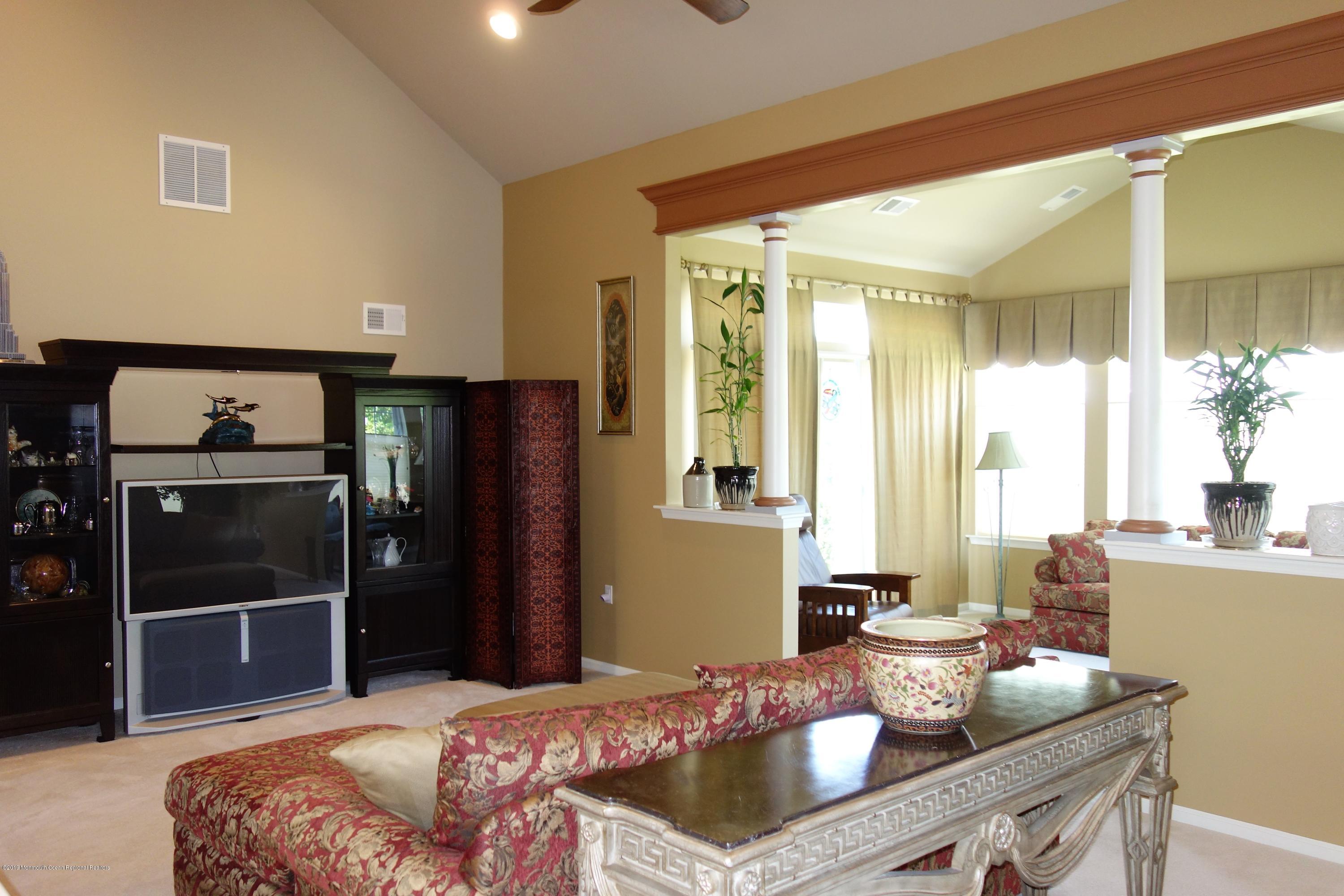 33 Pancoast Road Waretown, NJ 08758 - Photo 11 of 27 a bedroom with a bed and large window
