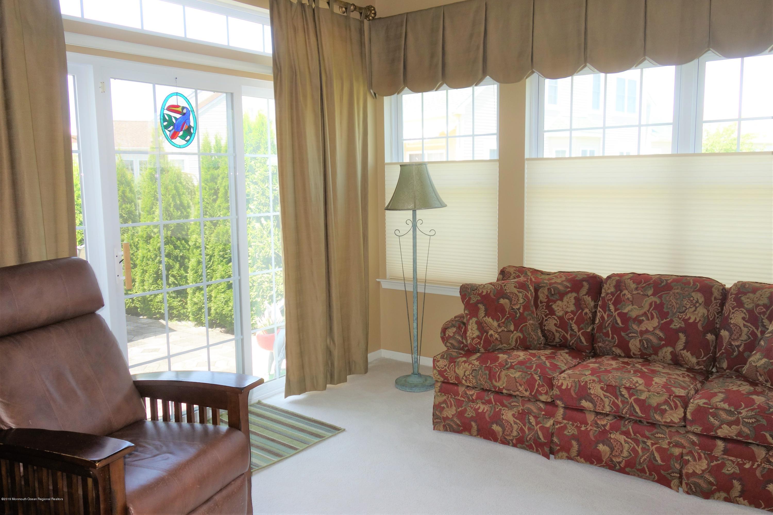33 Pancoast Road Waretown, NJ 08758 - Photo 13 of 27 a living room with furniture and a window
