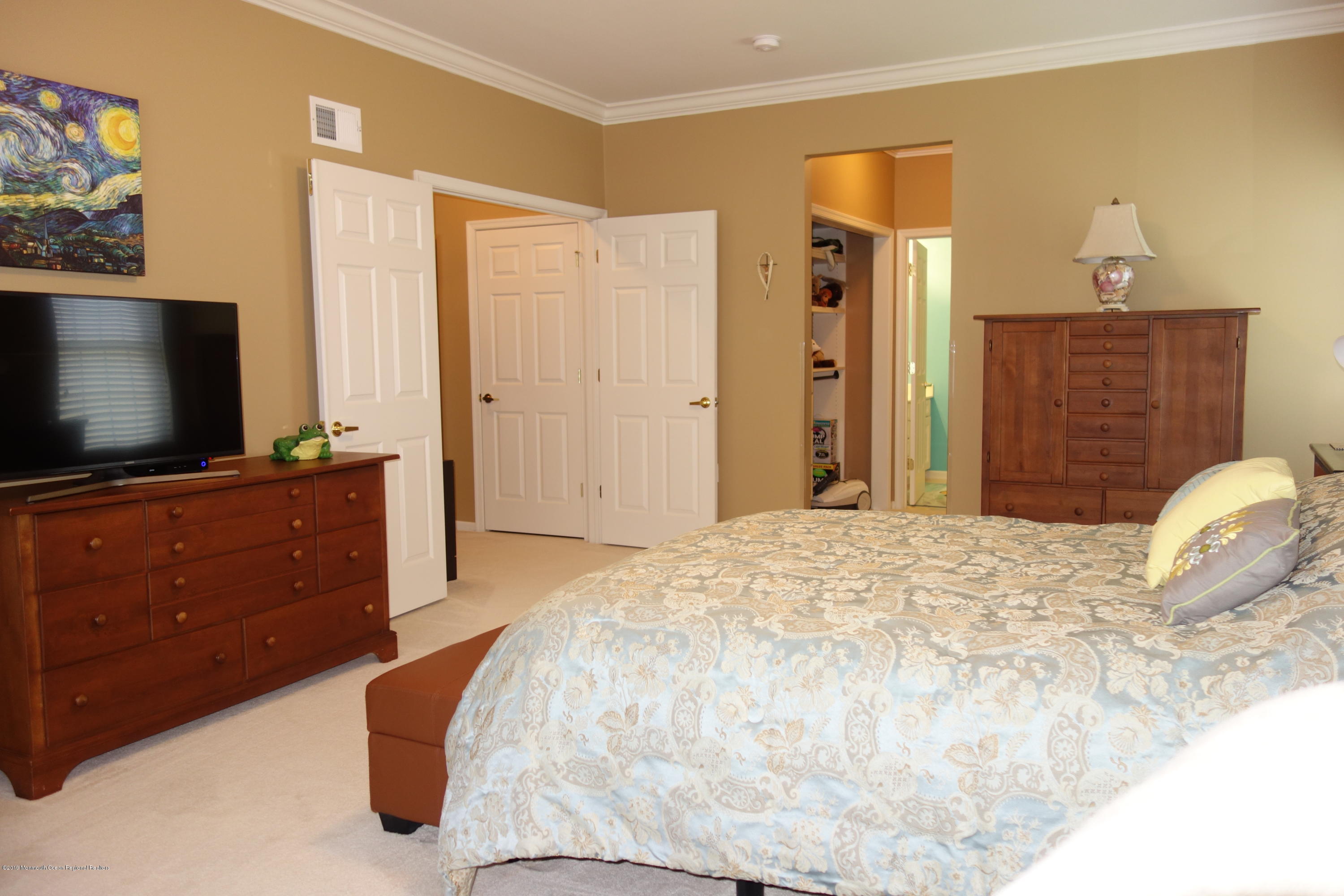33 Pancoast Road Waretown, NJ 08758 - Photo 14 of 27 a bedroom with a bed and a flat screen tv