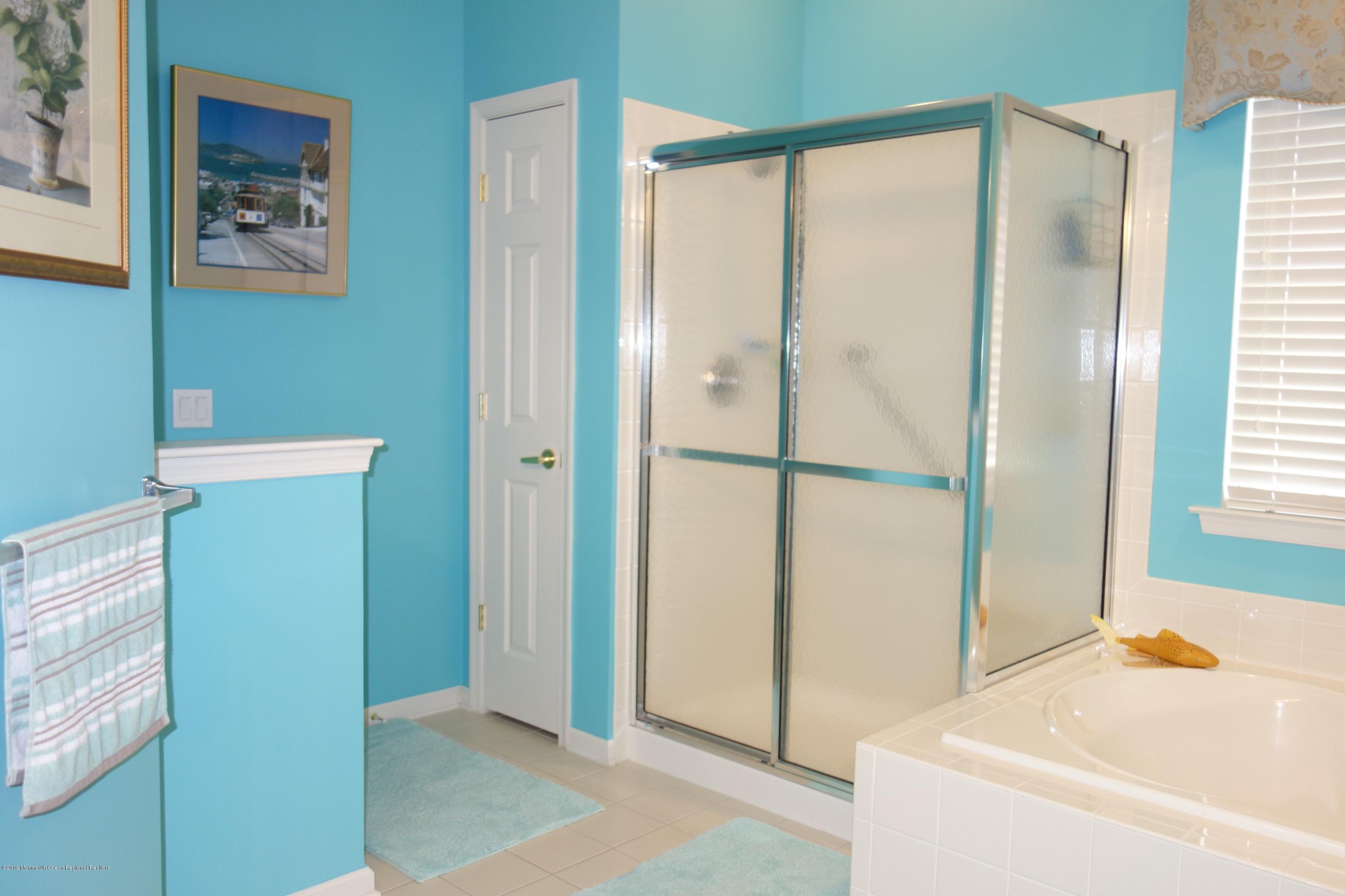 33 Pancoast Road Waretown, NJ 08758 - Photo 17 of 27 a bathroom with a shower and a tub