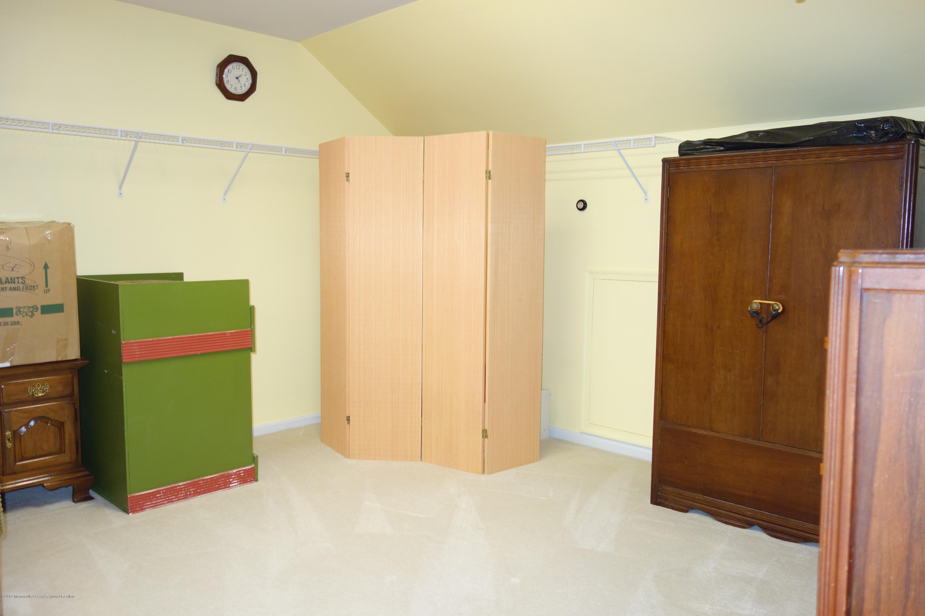 33 Pancoast Road Waretown, NJ 08758 - Photo 23 of 27 a view of a utility room with fridge and closet