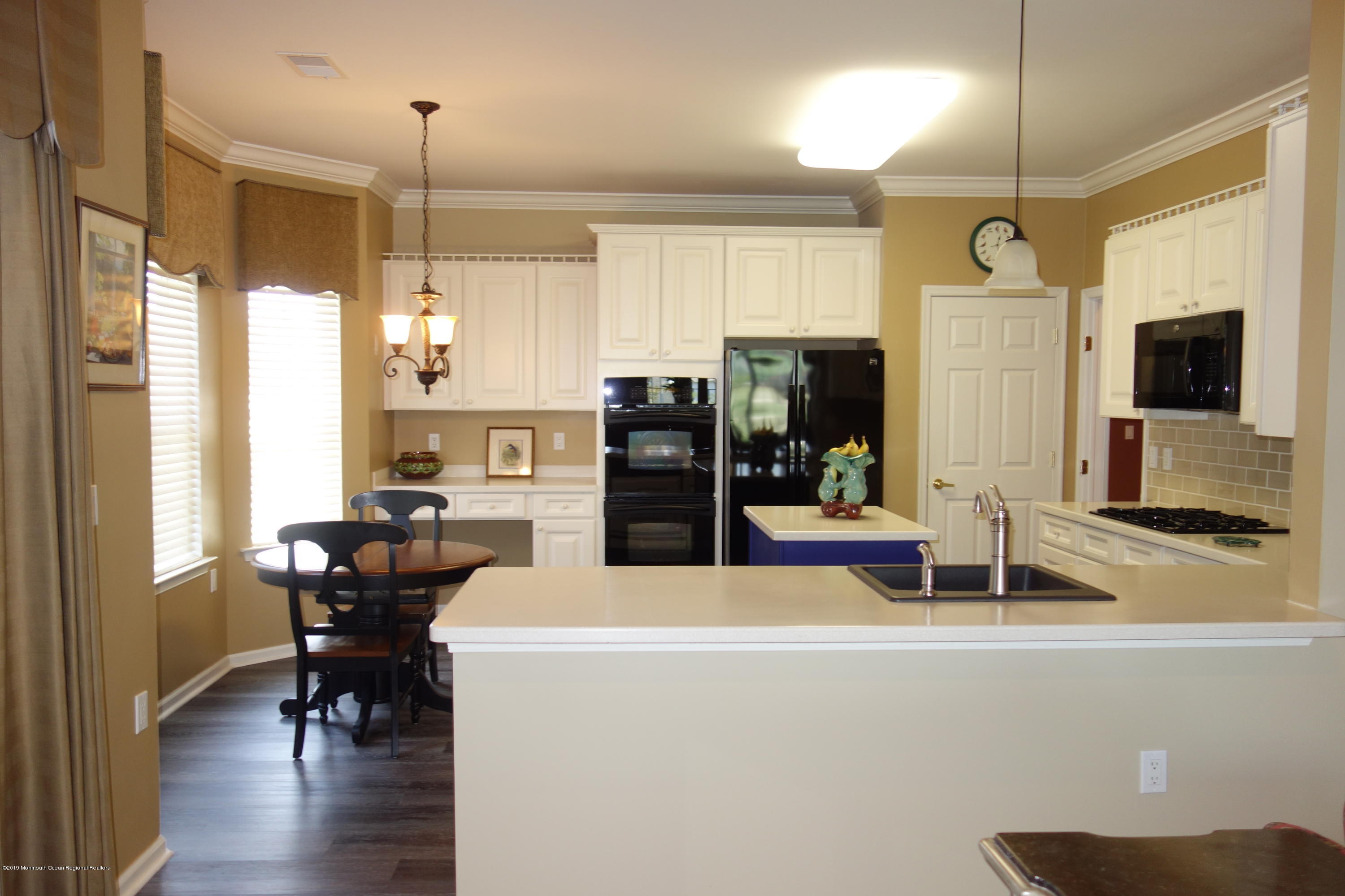 33 Pancoast Road Waretown, NJ 08758 - Photo 9 of 27 a view of a dining room with furniture window and wooden floor