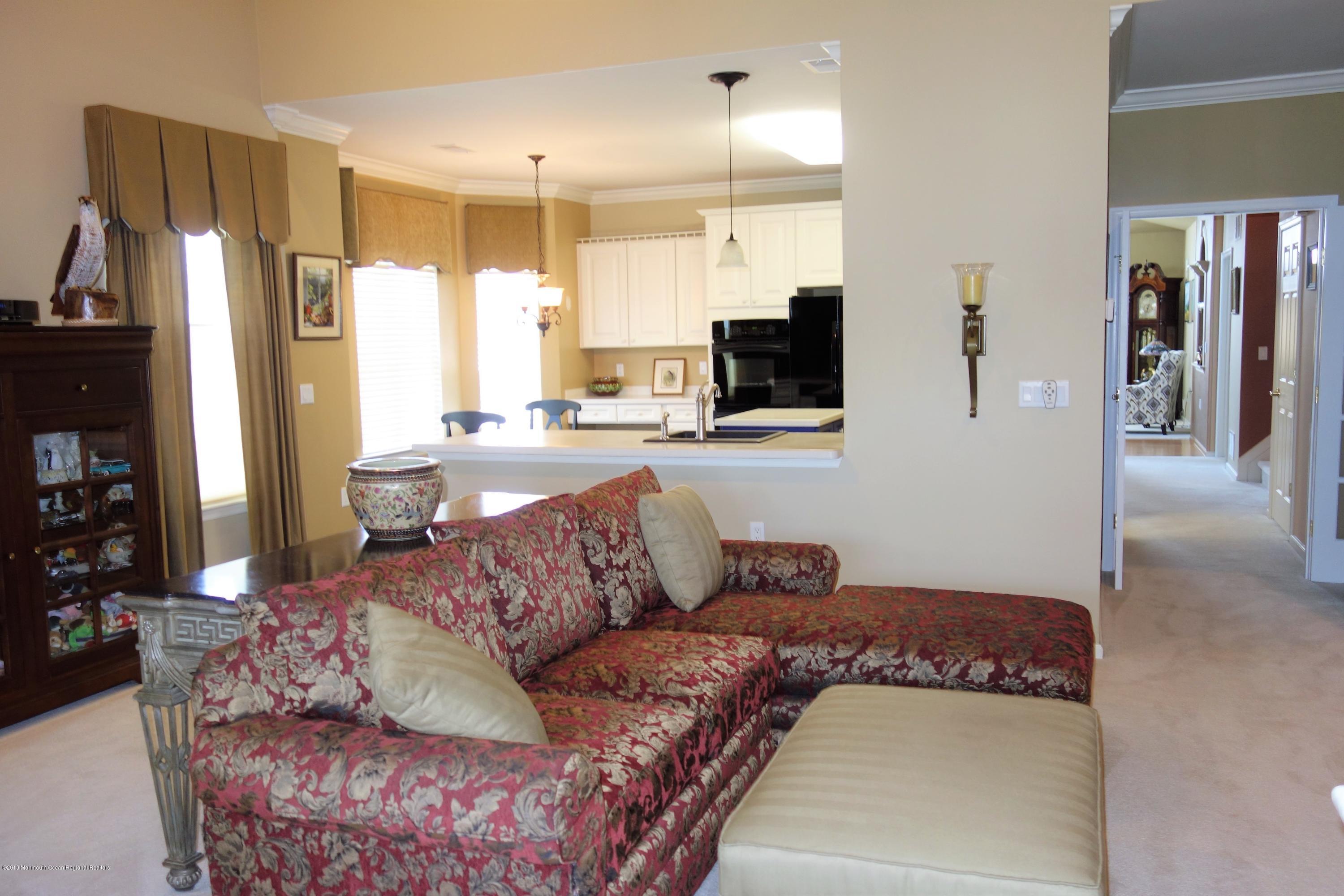 33 Pancoast Road Waretown, NJ 08758 - Photo 10 of 27 a living room with furniture and a flat screen tv