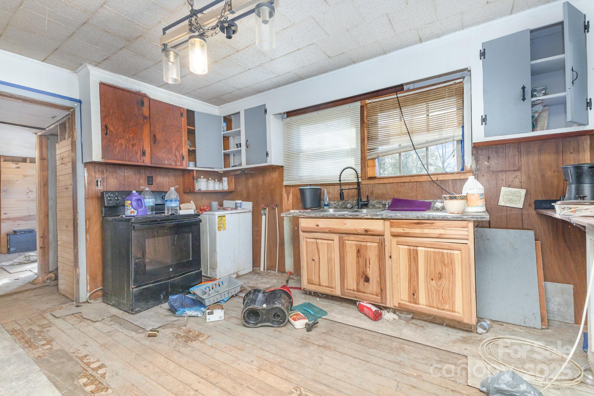 617 Hames Ridge Road Mooresboro, NC 28114 - Photo 11 of 20 a kitchen with stainless steel appliances granite countertop a refrigerator stove top oven and cabinets
