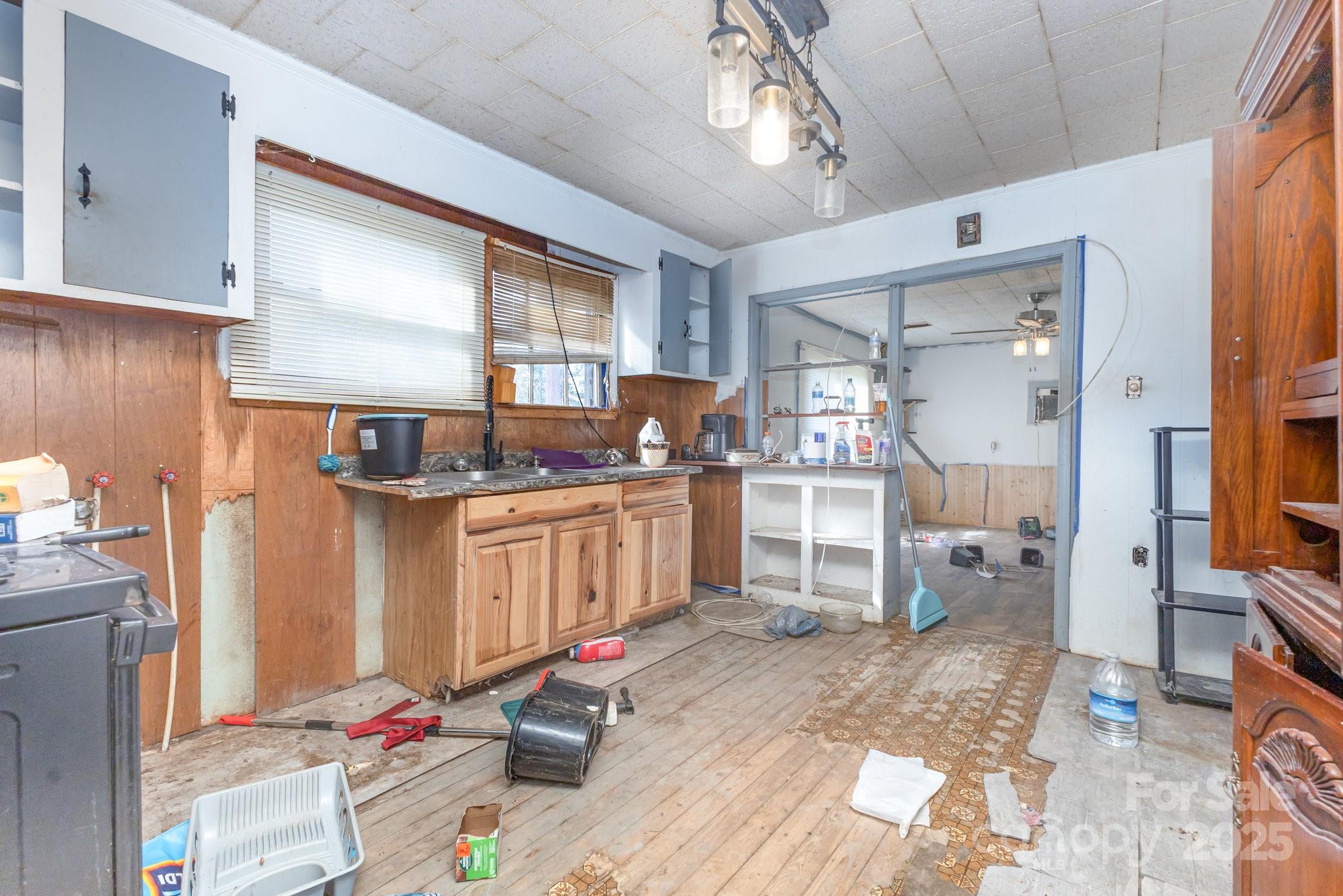 617 Hames Ridge Road Mooresboro, NC 28114 - Photo 12 of 20 a kitchen with cabinets and wooden floor