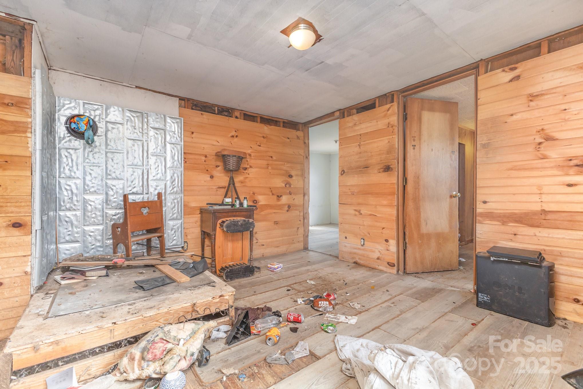 617 Hames Ridge Road Mooresboro, NC 28114 - Photo 13 of 20 a bedroom with a bed and a couch