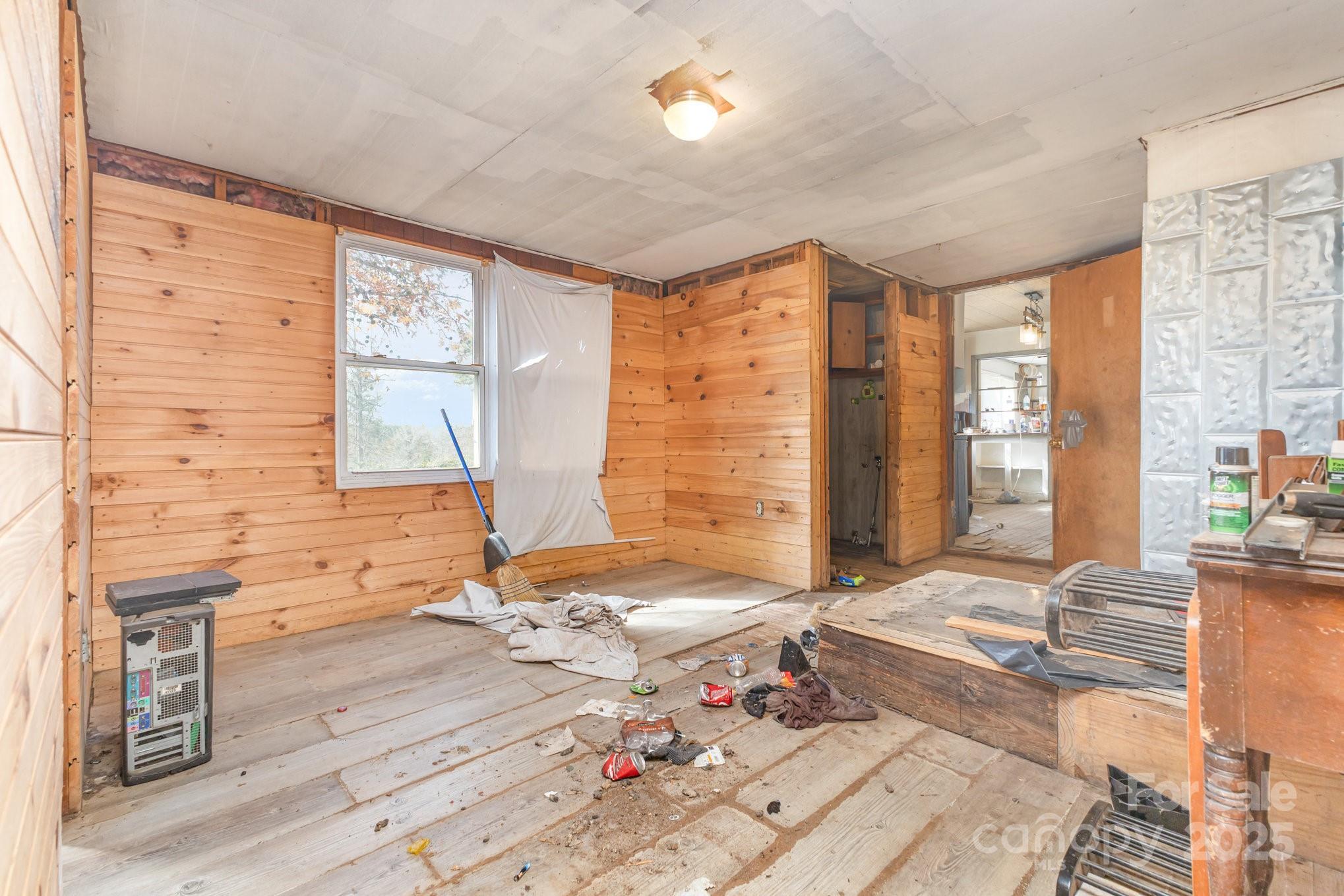 617 Hames Ridge Road Mooresboro, NC 28114 - Photo 14 of 20 a bedroom with a bed and wooden floor