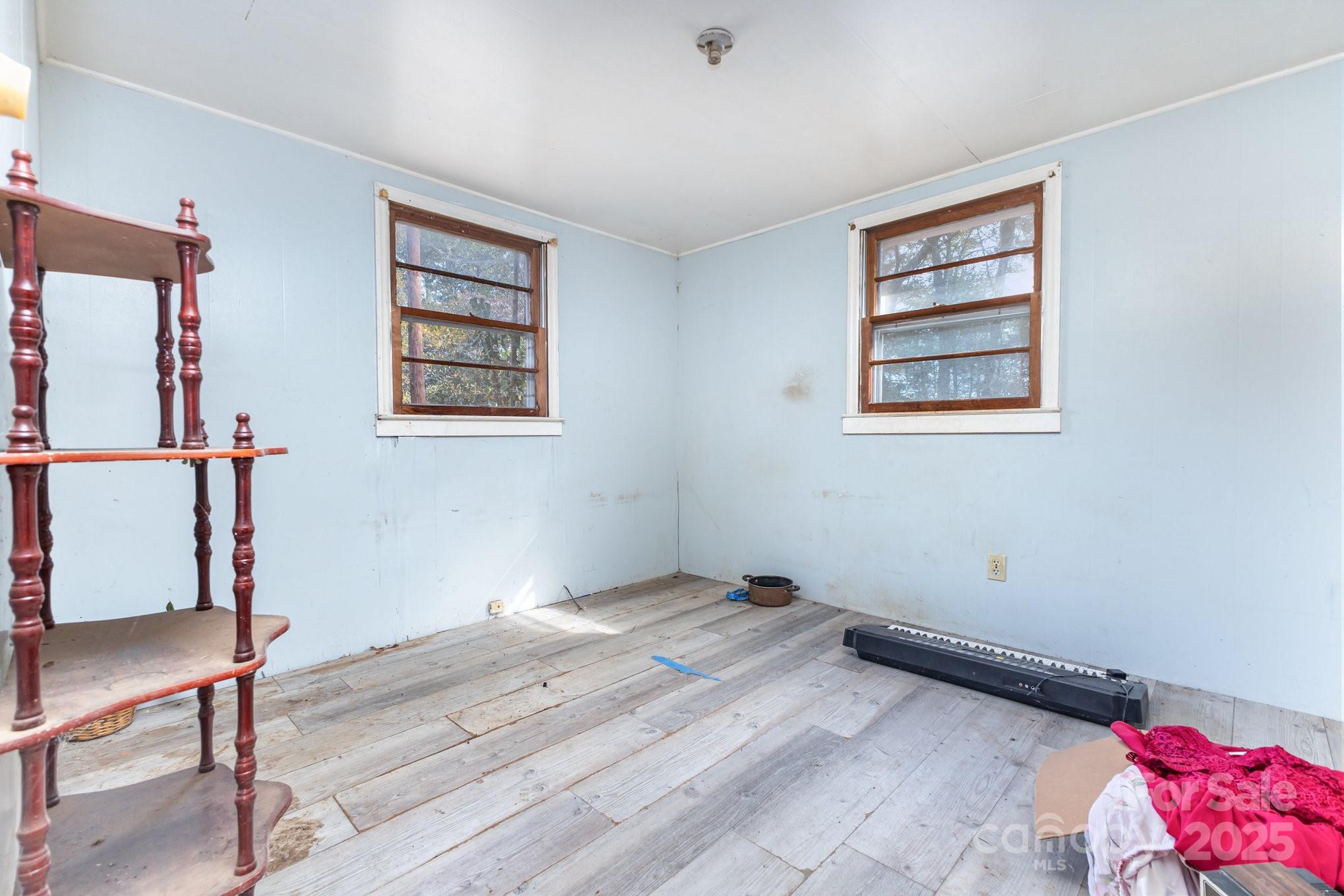 617 Hames Ridge Road Mooresboro, NC 28114 - Photo 15 of 20 a view of room with window and wooden floor