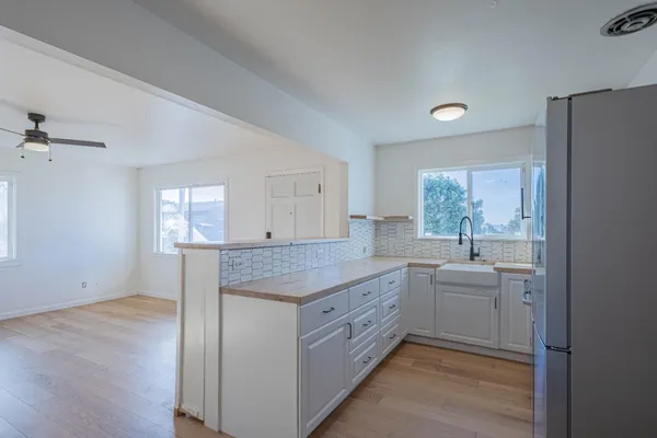a view of a kitchen island wooden cabinets and center island