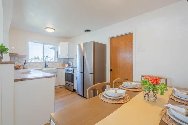 a kitchen with stainless steel appliances kitchen island granite countertop a sink and cabinets