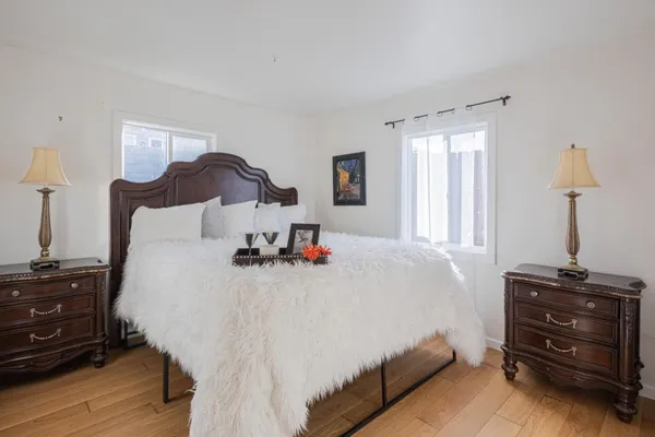 a bedroom with a bed and a dresser