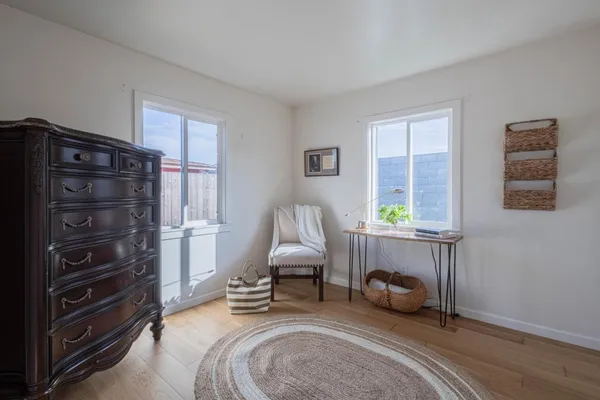 a bedroom with furniture and a window