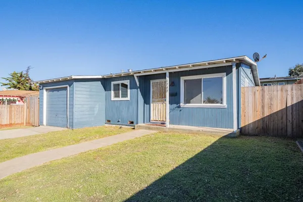 a front view of a house with yard