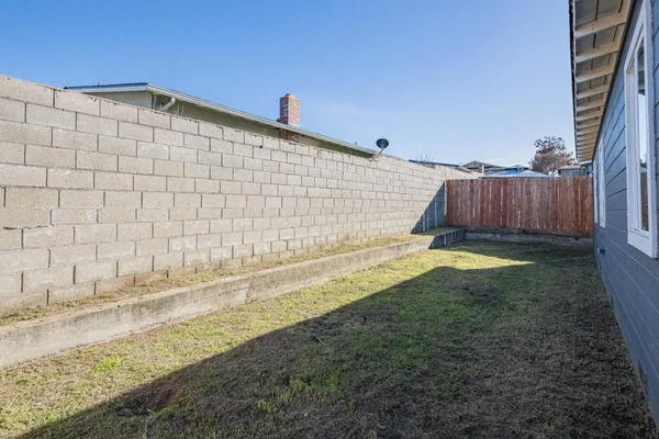 a view of a backyard of the house