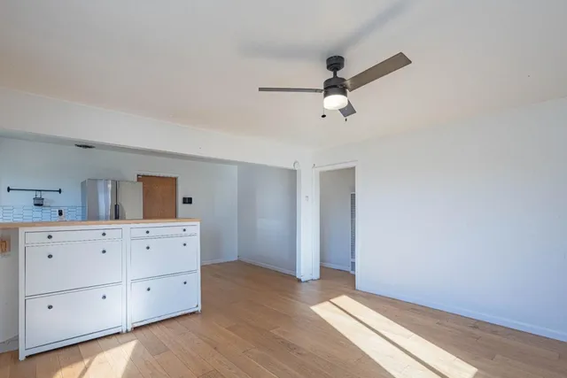 a view of a livingroom with wooden floor