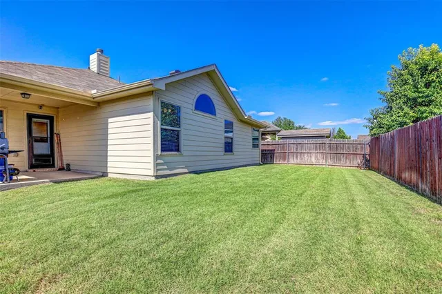 a view of a backyard with a garden