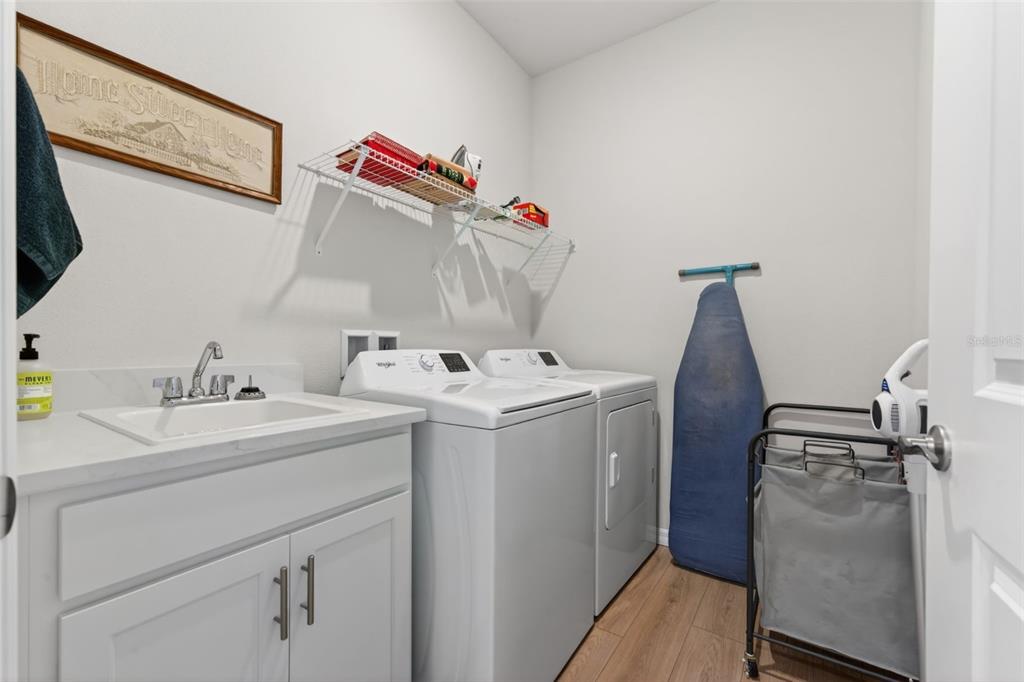 18237 Beach Ranch Terrace Bradenton, FL 34211 - Photo 48 of 72 a utility room with dryer and washer