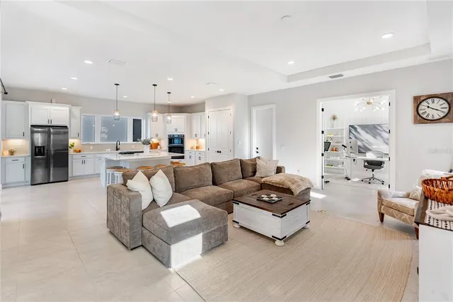 a bedroom with a large bed and a flat screen tv