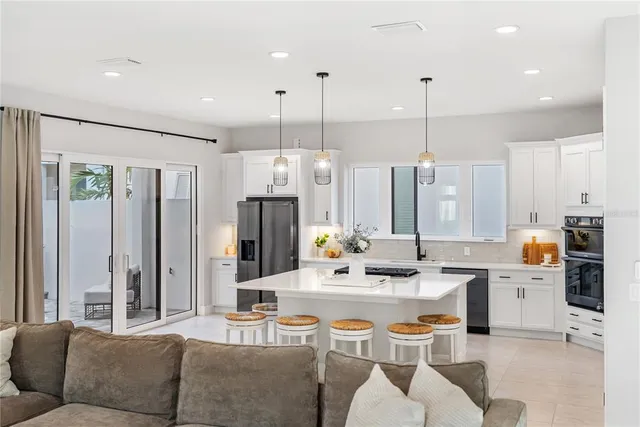 a bathroom with a double vanity sink a mirror and a bathtub