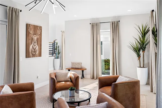 a living room with furniture and white walls