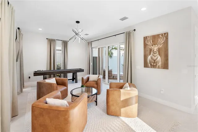 a spacious bedroom with two beds and a couch