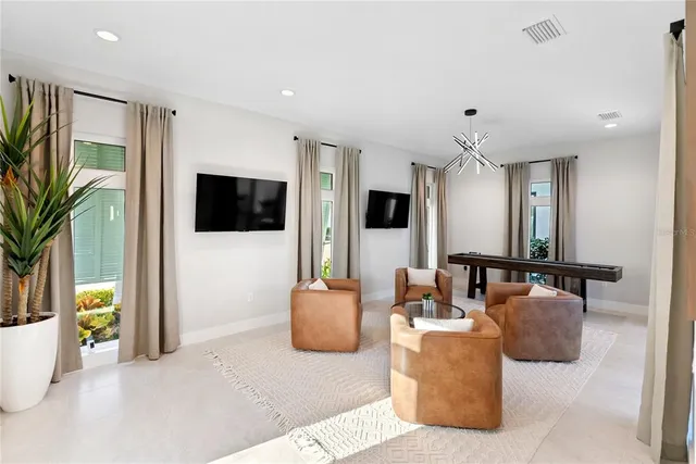 a bathroom with a sink a faucet a mirror and a shower