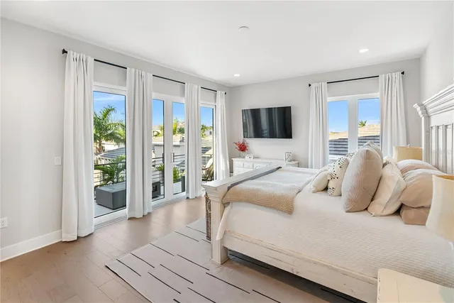 a view of a patio with a table and chairs under an umbrella