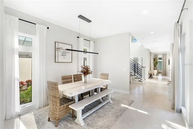 a kitchen with appliances a sink and cabinets
