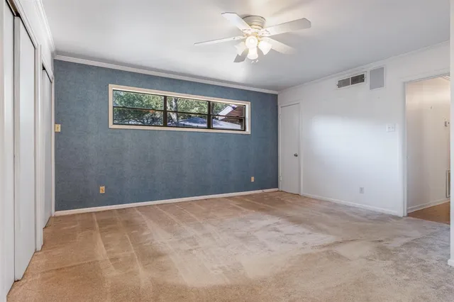 a bathroom with a sink a toilet a mirror and a shower