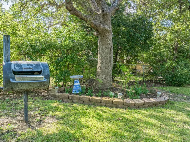 a house view with a garden space