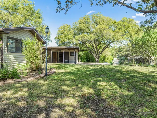 front view of a house with a garden