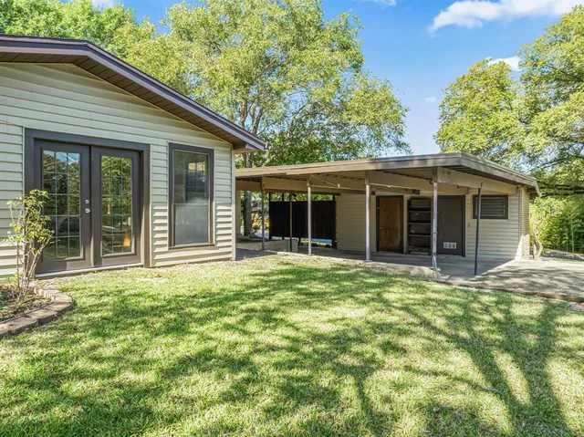 a backyard of a house with seating space