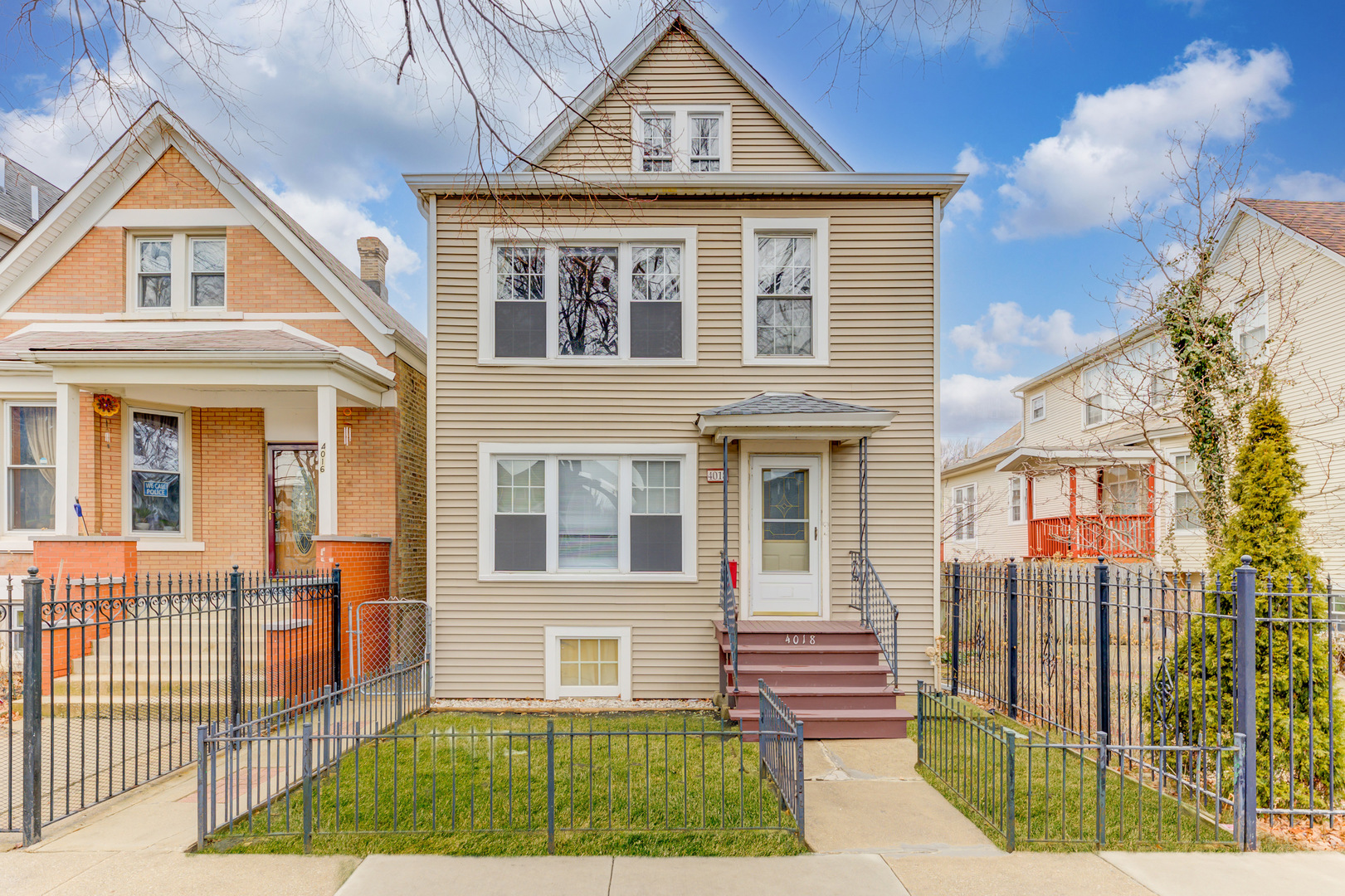 4018 North Whipple Street Chicago, IL 60618 - Photo 1 of 25 a front view of a house with a yard