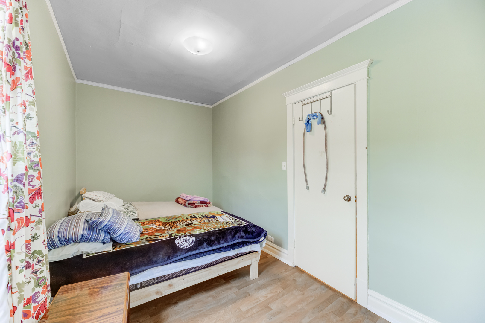 4018 North Whipple Street Chicago, IL 60618 - Photo 13 of 25 a bedroom with a bed and a dresser in it