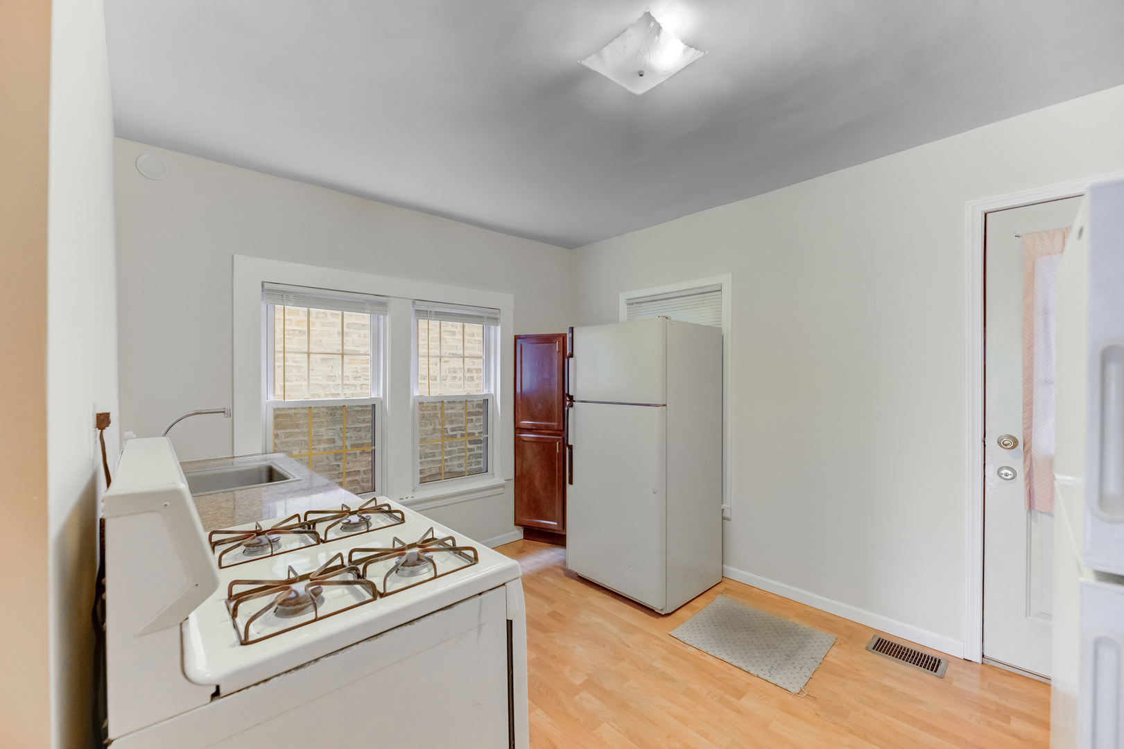 4018 North Whipple Street Chicago, IL 60618 - Photo 14 of 25 a kitchen that has a stove and a refrigerator