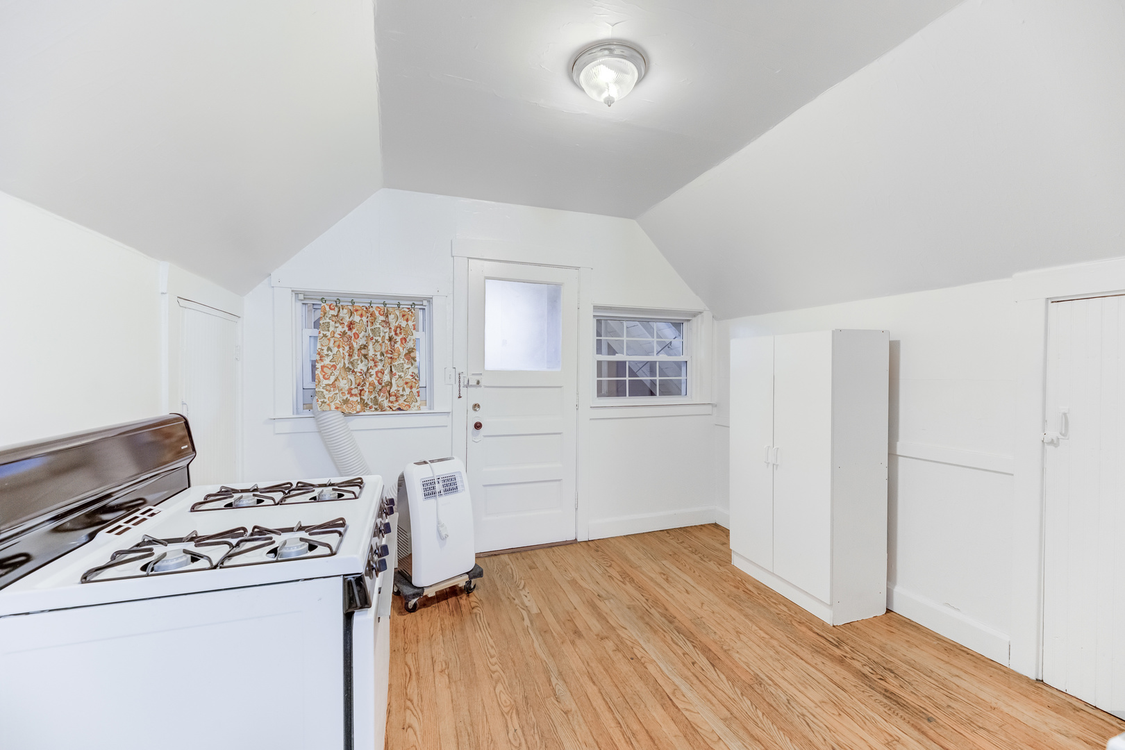 4018 North Whipple Street Chicago, IL 60618 - Photo 17 of 25 a room with a stove and a refrigerator