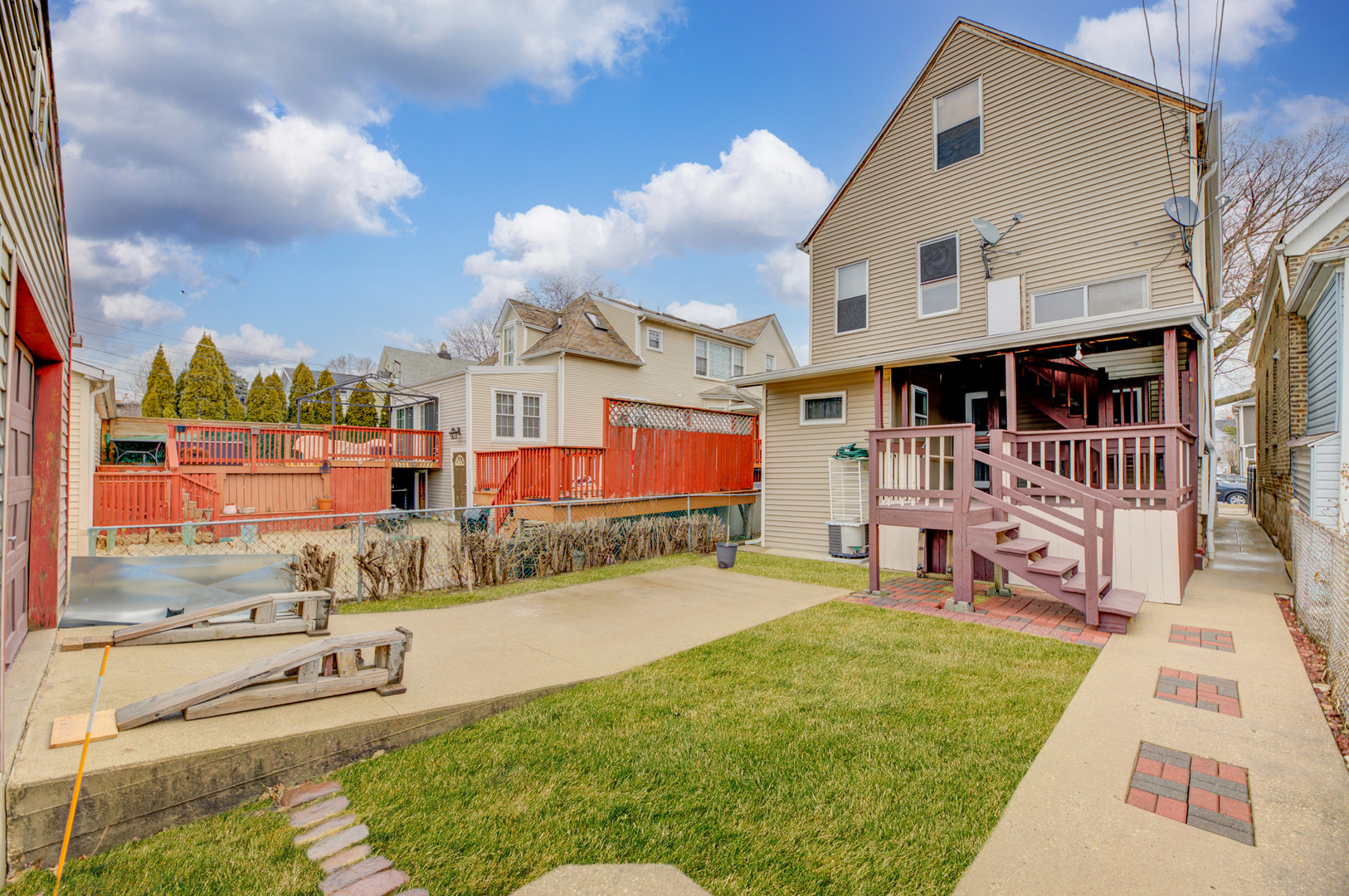 4018 North Whipple Street Chicago, IL 60618 - Photo 25 of 25 a view of a house with a yard and deck